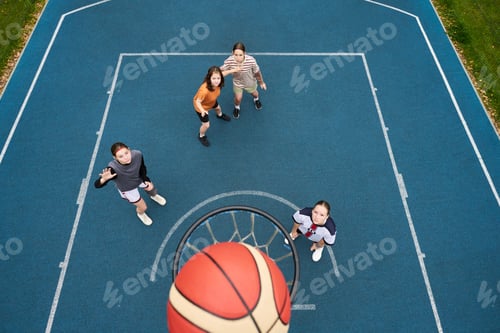 Preview: Group of Teenagers Playing Streetball and Shooting Basketball Toward Hoop