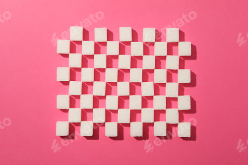 Preview: Flat lay with sugar cubes on pink background, top view