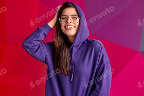 Preview: Young hipster laughing and looking at camera