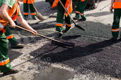 Preview: Workers on Asphalting paver machine during Road street repairing works.