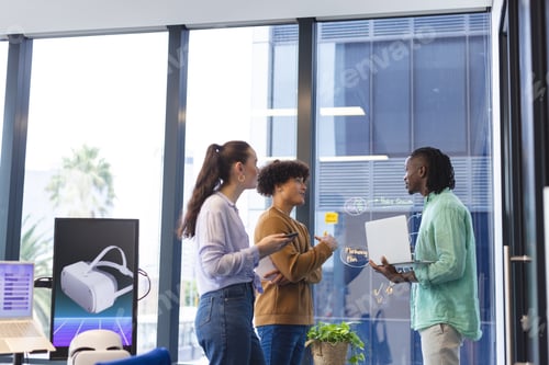 Preview: Diverse team discussing VR graphs in office
