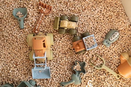 Preview: A modern children's sandbox with toys. Sandbox filler in the form of wooden small wooden cubes