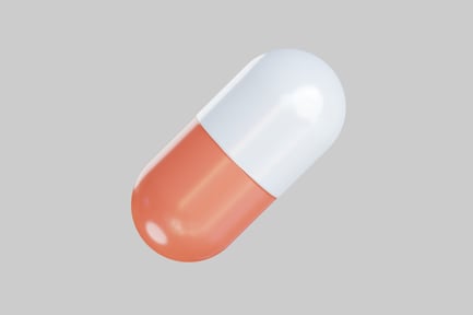 Preview: Orange and white medical capsule