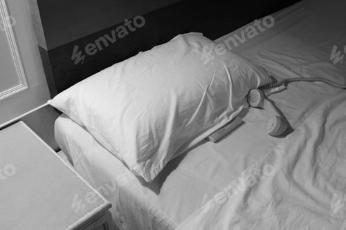 Preview: Old telephone on the bed in hotel