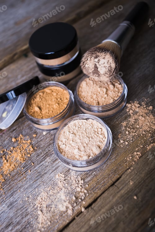 Preview: mineral powder of different colors with a brush for make-up on wooden background
