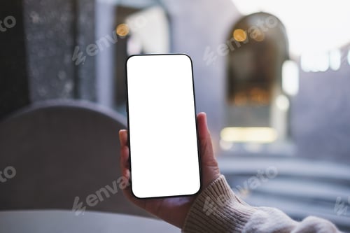 Preview: Mockup image of a woman holding and using mobile phone with blank desktop screen in cafe