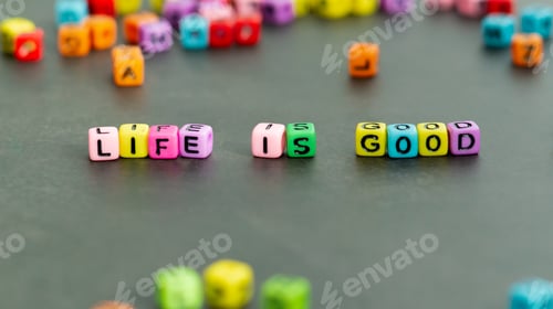 Preview: Life is good slogan in multicolor letter block beads. Front view.