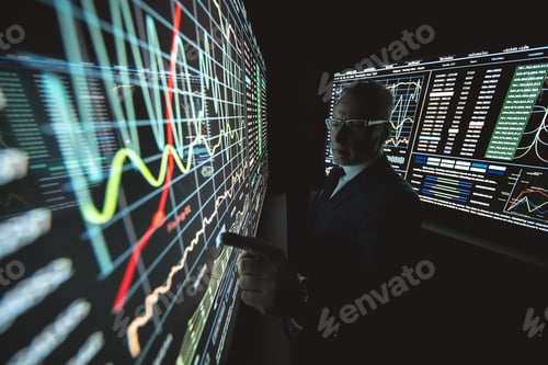 Preview: The man working on the big sensor display in the dark lab