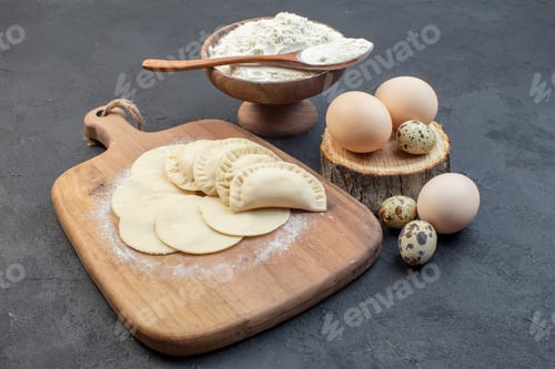 Preview: front view raw little hotcakes with flour and eggs on dark background pie dough oven cake bake