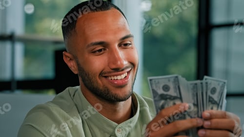 Preview: Male portrait happy smiling rich success Latin man counting money African American businessman