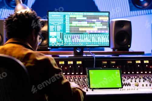 Preview: Man Works at Audio Mixing Desk