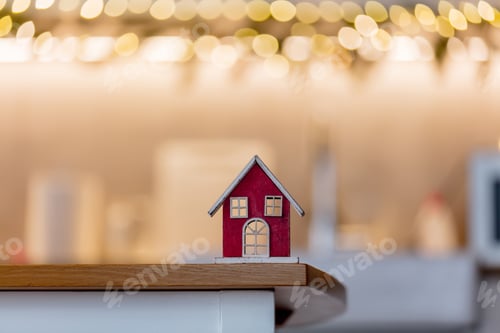 Preview: house on a table in a kitchen with Christmas lights