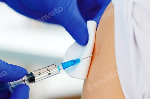 Preview: Doctor hands making a vaccination in the shoulder of patient