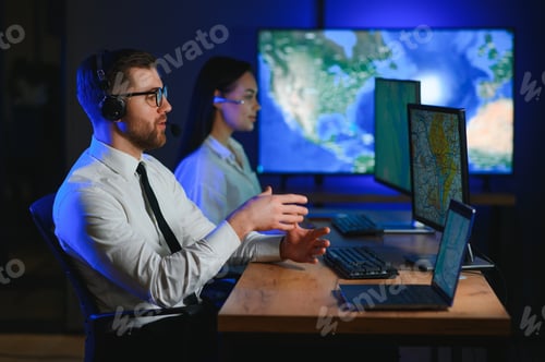 Preview: In Monitoring Room Technical Support Specialist Speaks into Headset.