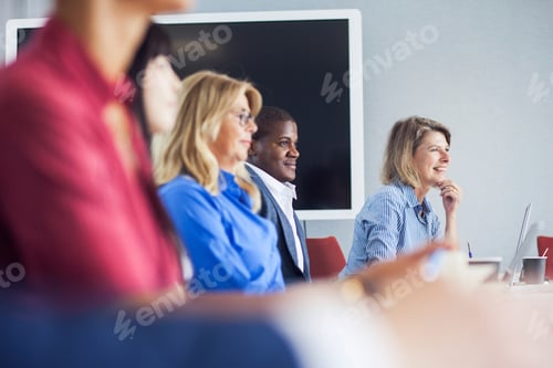 Preview: Engaged audience listening intently at a presentation.