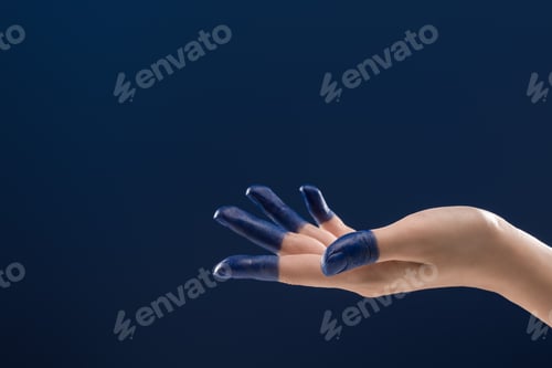 Preview: cropped view of female hand with painted fingers isolated on blue