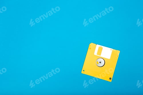 Preview: Yellow floppy disk on a plain blue background with simple design elements