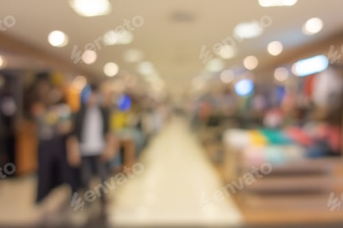 Preview: Abstract bokeh blurry background of retail shops in shopping mall or complex department.