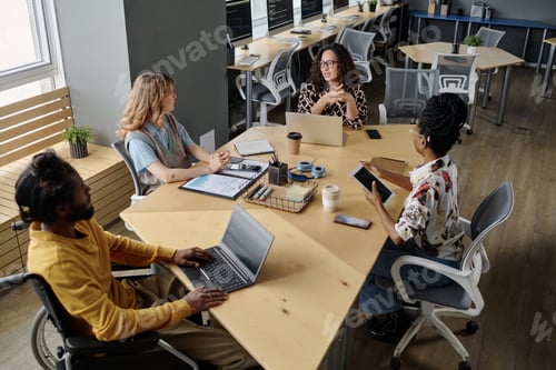 Preview: Diverse Group of Office Workers Discussing Business Project at Meeting
