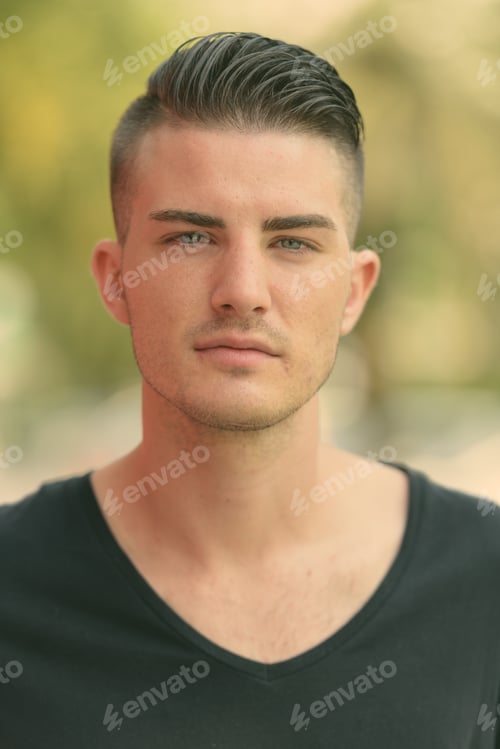 Preview: Face of young handsome man in the parking lot