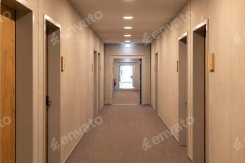 Preview: A modern hallway features a uniform design with multiple doors lining both sides.