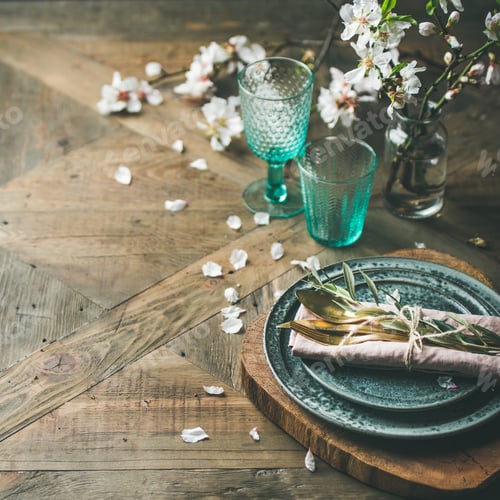 Spring Easter Table setting over vintage wooden background, square crop