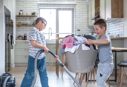 Preview: Two little boys help with the laundry and cleaning of the house.