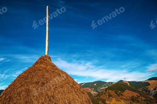 Preview: A large haystack against the backdrop of the wonderful nature of the Carpathians and the