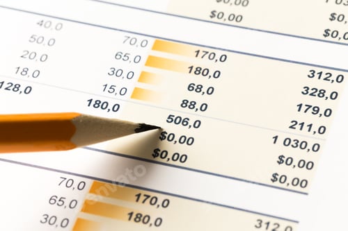 Preview: Financial spreadsheet with calculations highlighted in a study environment