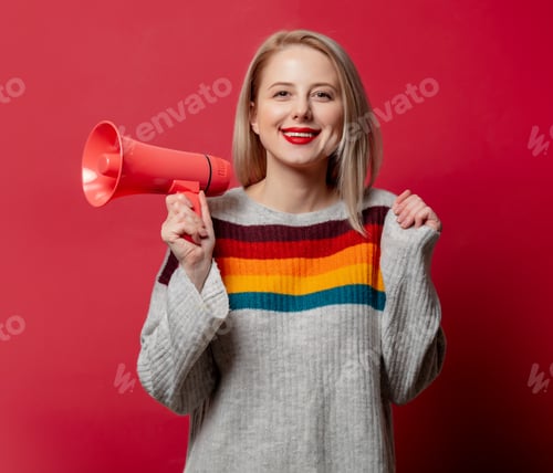 Preview: Beautiful blonde in sweater wtih megaphone