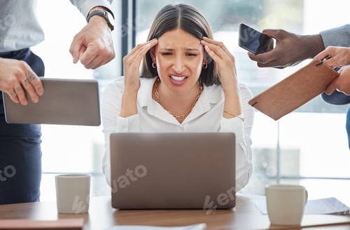 Vista previa: Shot of a young businesswoman feeling stressed out in a demanding office environment at work