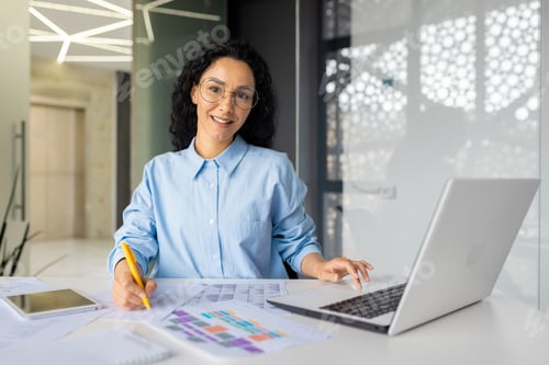 Preview: Portrait of young beautiful and successful financial accountant at workplace inside office