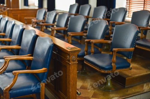 Preview: Empty jury box with blue leather chairs and windows in the background