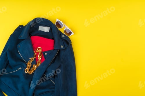 Preview: Trendy woman outfit with accessories on bright yellow background