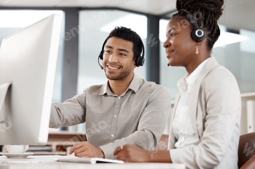 Preview: Your attitude determines how well you do it. Shot of two colleagues working in a call center.