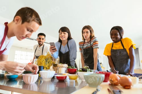 Preview: Friends in a cooking workshop watching instructor