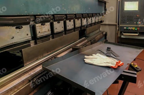 Preview: Factory at metal skip machine putting work piece in with sheet metal and special machine tools for
