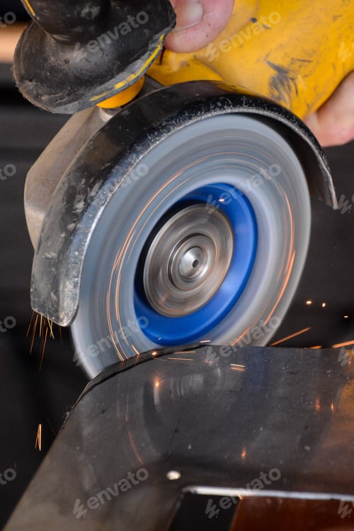 Preview: Cutting steel with angle grinder at car service