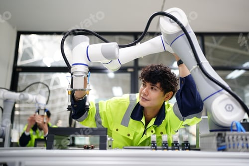 Preview: Robotic Arm engineer check on equipment in its with software of Artificial Intelligence Unit.