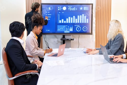 Preview: Employee on job corporate Business colleagues around the table look presentation from large screen