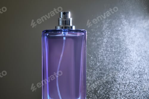 Preview: Perfume spray in a violet bottle on a dark background.