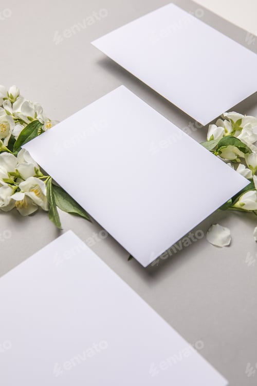 Preview: Mock up with attached natural fresh jasmine flowers on a gray background, copy space.