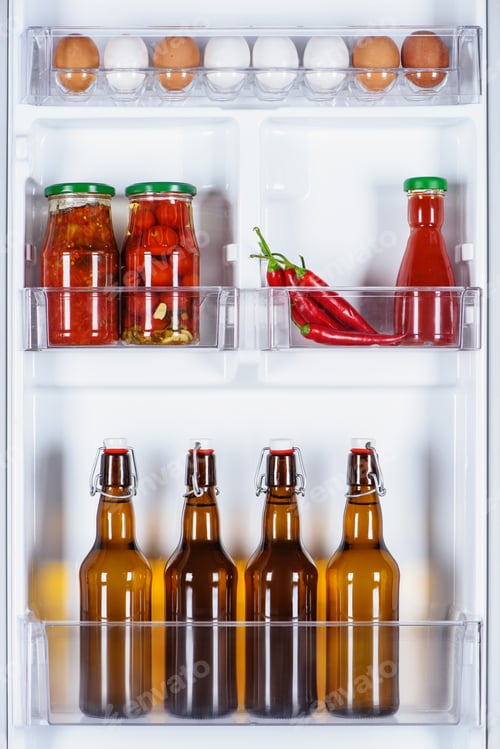 Preview: eggs and glass bottles of beer in fridge