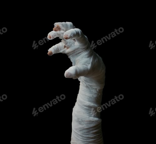 Preview: Halloween background. Bandaged hands of a zombie on a dark background. Halloween design.