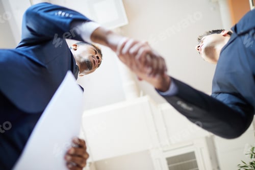Preview: Business handshake at office