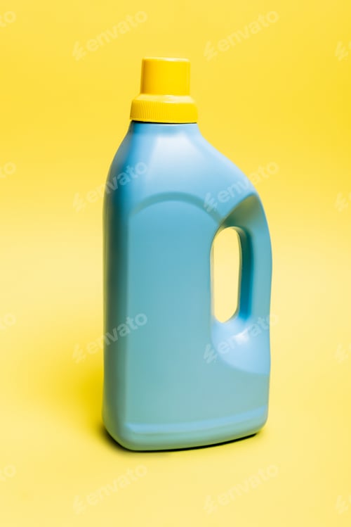 Preview: Blue bottle of detergent on yellow background