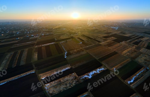 Preview: Aerial view of plowed agricultural field prepared for planting crops in spring