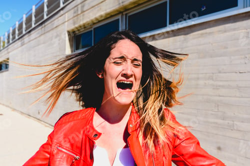 Preview: Frightened young woman gesturing with fear after a robbery.