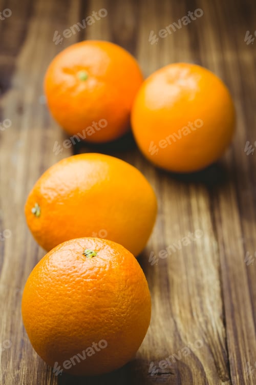 Preview: Fresh oranges on wooden background