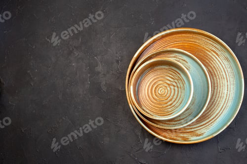 Preview: top view brown big tray with same colored plate on dark background color ceramic glass food table